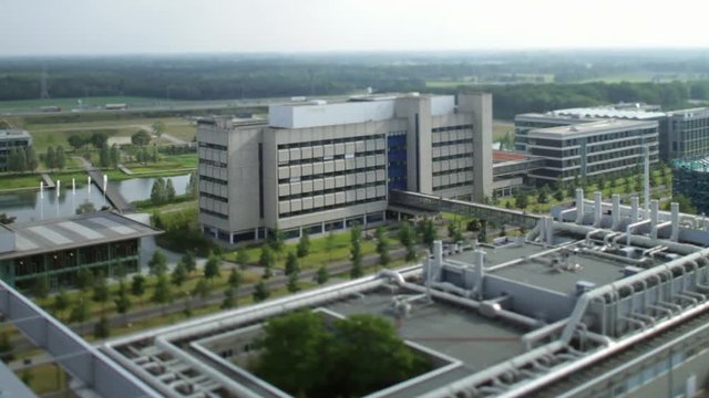 Overview of The High Tech Campus in Eindhoven towards Highway in the background. Brainport. Noord-Brabant. Timelapse / Tilt-shift / Topshot.