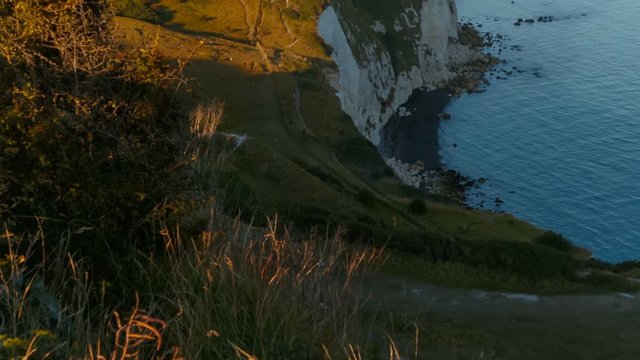 Telephoto shot of the beautiful White Cliffs of Dover, in Kent, England. The cliffs face reaches a height of 110 m. The White Cliffs are a designated Area of Outstanding Natural Beauty