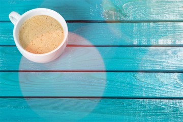 Coffee cup  on wooden background