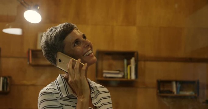 Business woman taking on mobile phone at office 4k