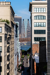 Brooklyn, NY / USA - JUL 31 2018: Buildings in Dumbo with Lower Manhattan skyscrapers in background view