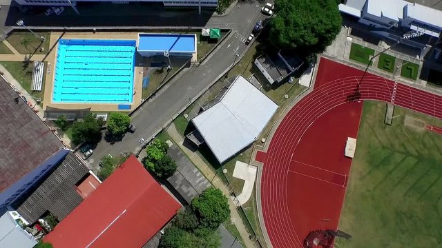 Aerial: Bird's eye of olympic swimming pool's.