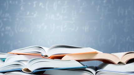 Books are opened and piled together on