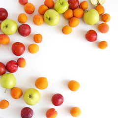 Plum, apples and apricots isolated on white background. Creative flat layout of fruit, top view.