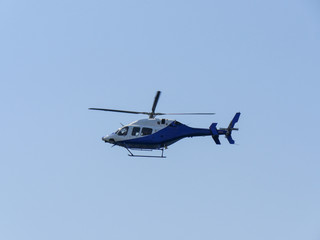 Fototapeta na wymiar Helicopterflying in the sky