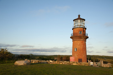 Fototapeta na wymiar Brick Tower of Aquinnah Lighthouse Surrounded by Stone Wall on Martha's Vineyard Island in Massachusetts
