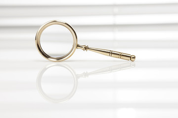 golden magnifier at the office