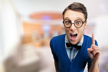 Young nerd man posing on background