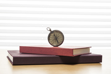 vintage compass on the wood table at the office © dohee