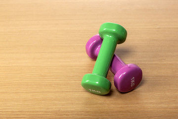 dumbbell on the wood table at the office