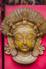 Fototapeta na wymiar Traditional Handmade Wooden Masks and Sculptures,Kumari Sculpture