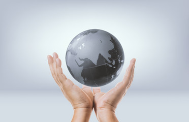 hand and globe