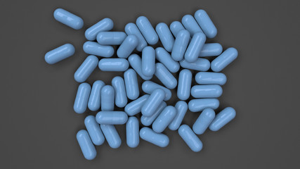 Pile of blue medicine capsules
