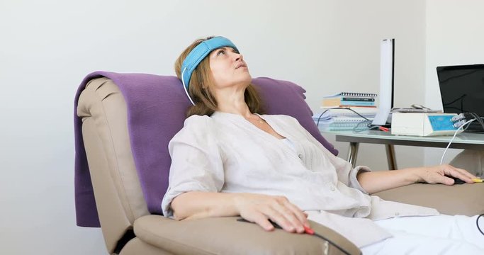Biofeedback Patient Being Tested by Doctor