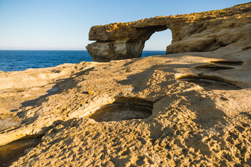 Gozo Island Azure Window Sea Arch and Limestone Formations at Sunrise .
