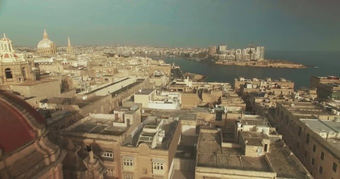 Aerial Shot - Moving backwards from the city to a small Dome