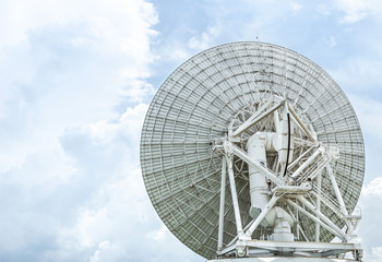 back side view big white satellite dish turn up skyward in communication center station