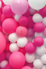 Background of pink and white air balloons close up