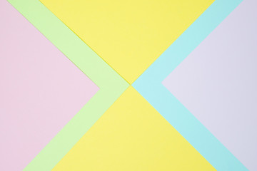 Pastel colored paper flat lay top view, background texture, pink, purple, yellow, beige, green and blue.