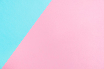 Pastel colored paper flat lay top view, background texture, pink and blue.