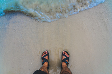 Walking on Beautiful Tropical Beach blue ocean background with Traveler  items vacation stuff...