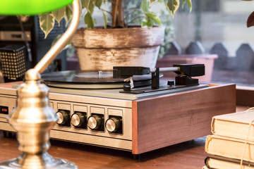 Retro interior design with vintage items in the style of 70-80 years. Old music player.
