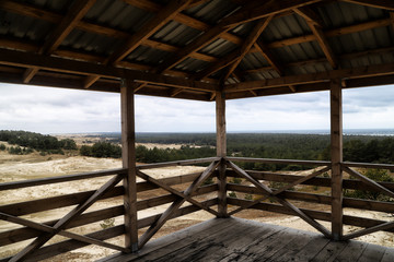 Wooden observation deck with a beautiful view of the dunes of the Curonian spit