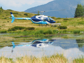A Bell 216 helicopter at Vivione mountain pass, Italian Alps
