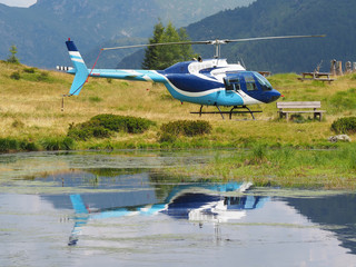 A Bell 216 helicopter at Vivione mountain pass, Italian Alps