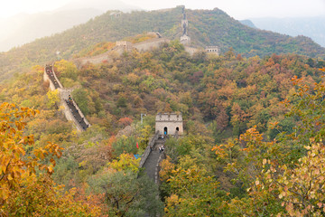 China The great wall distant view compressed towers and wall segments autumn season in mountains near Beijing ancient chinese fortification military landmark in Beijing, China.