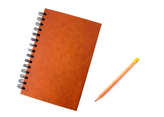 Notebooks and pencils with white backdrop.