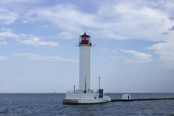 Fototapeta na wymiar Lighthouse in the sea, Black sea, Odessa, Ukraine