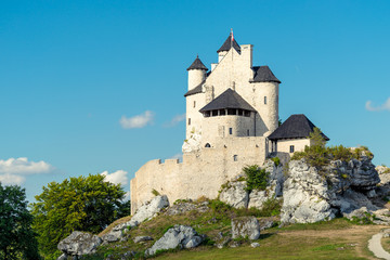Fototapeta na wymiar Bobolice, Poland - August 13, 2017: medieval castle of Bobolice against the blue sky
