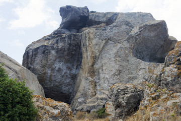 Rocky landscape and rock formations in the island of Patmos, Greece in summer time