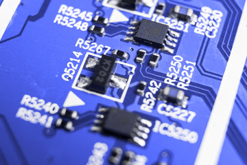 Macro shot of a Circuitboard with resistors microchips and electronic components. Computer hardware...