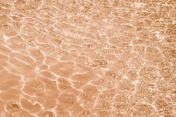 Fototapeta premium Abstract texture of water, tinted in light brown color_