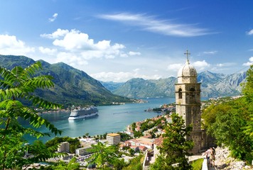 Church tower and venetian architecture of an old Mediterranean town, Bay of Kotor - obrazy, fototapety, plakaty
