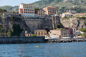  View of houses and hotels on the cliffs in Sorrento. Gulf of Naples, Campania, Italy