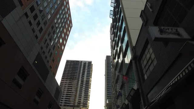 Buildings from a unique perspective shot from a stabilised gimbal mount outside a car.