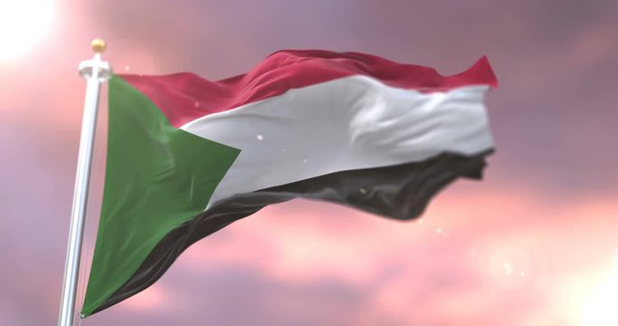 Flag of Sudan waving at wind in slow at sunset, loop