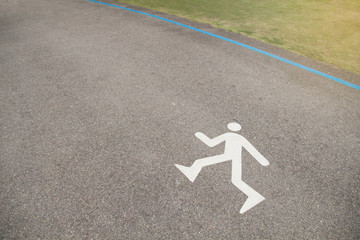 Walk or run sign painted on the asphalt on street lane for a running and walking path sign on
