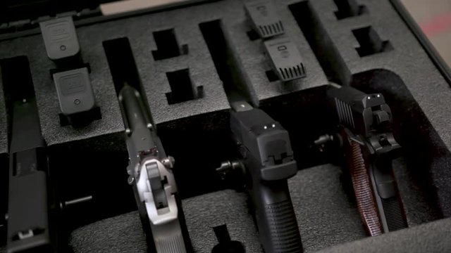 Shot in Joliette, Quebec, Canada A bunch of cases filled with firearms,