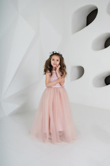 Fototapeta na wymiar portrait of a little girl in pink dress