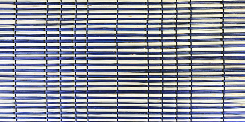 Wicker stand for dishes made of natural straw. Kitchen accessories. For the dining room for guests.