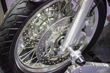 close up - wheel spokes and brake disc of a motorcycle