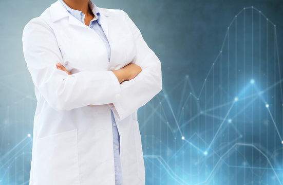 science and medicine concept - female doctor or scientist over blue background and diagrams charts holograms