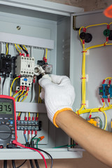 Electrical terminal box. Control panel with magnetic contactor and overload relay. Checking...