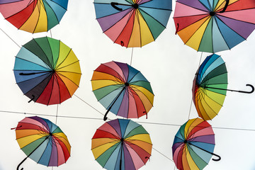 Pride colored umbrellas in the sky