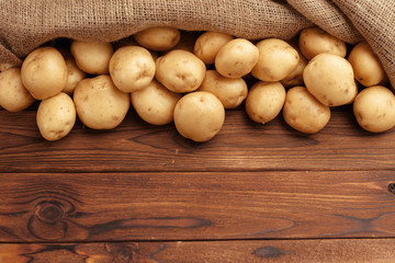 Pile of potatoes lying on wooden boards