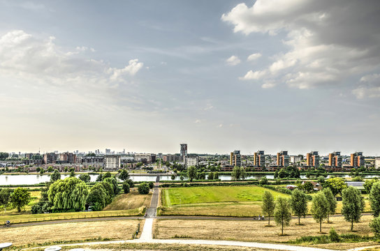 View from an artificial hill towards the suburb of Carnisselande with the Rotterdam skyline in the distance